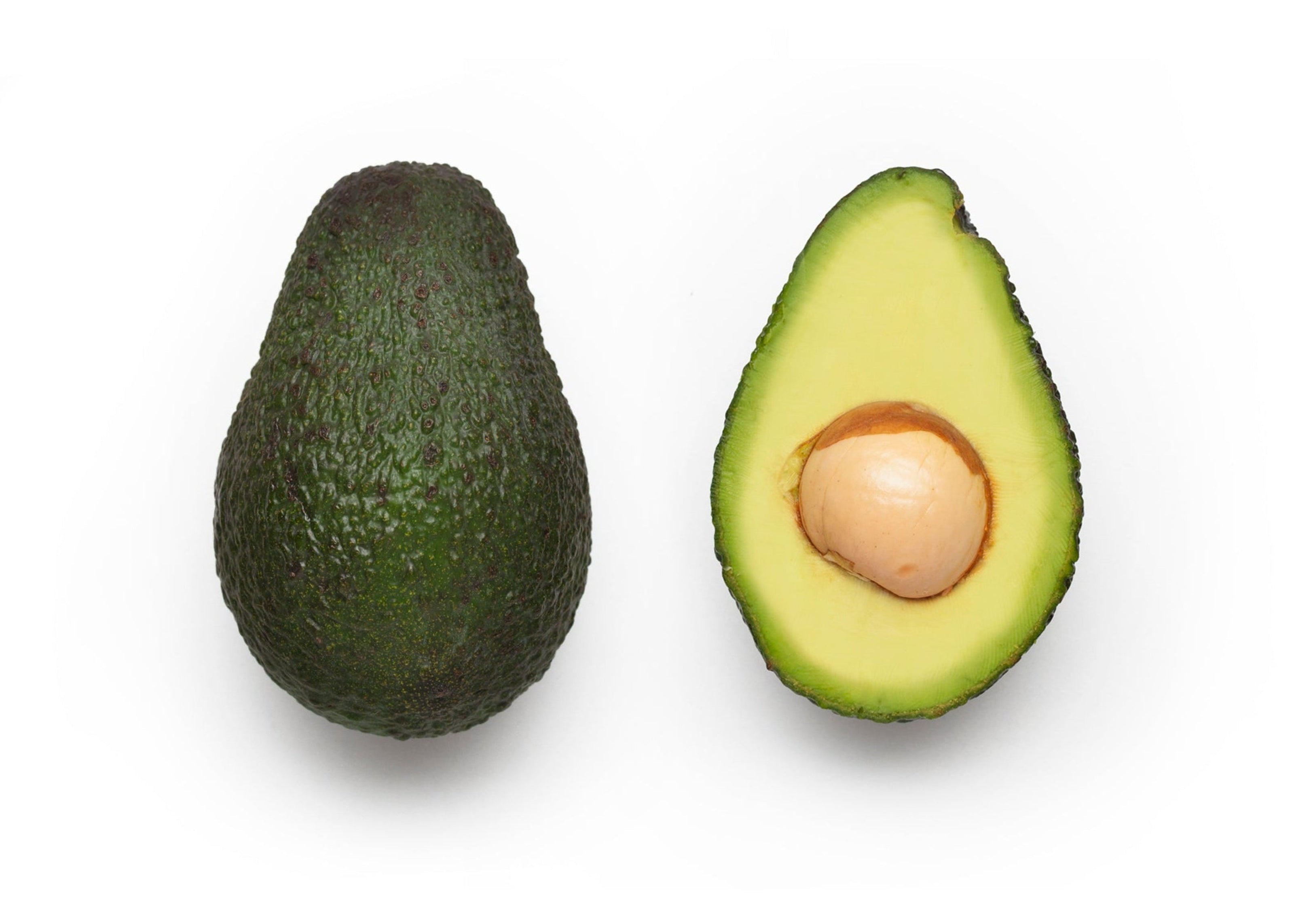 Whole avocado and half avocado on a white background