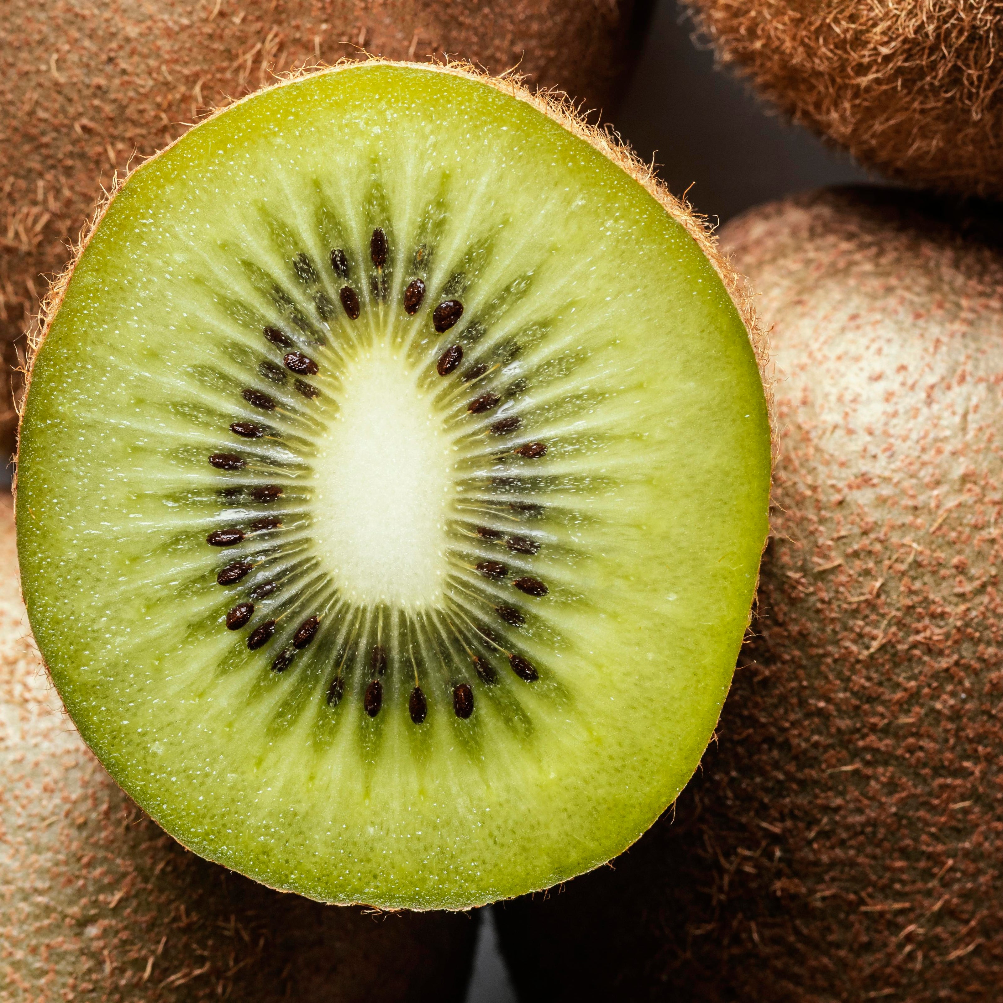 Close-up of a sliced kiwi fruit with seeds visible