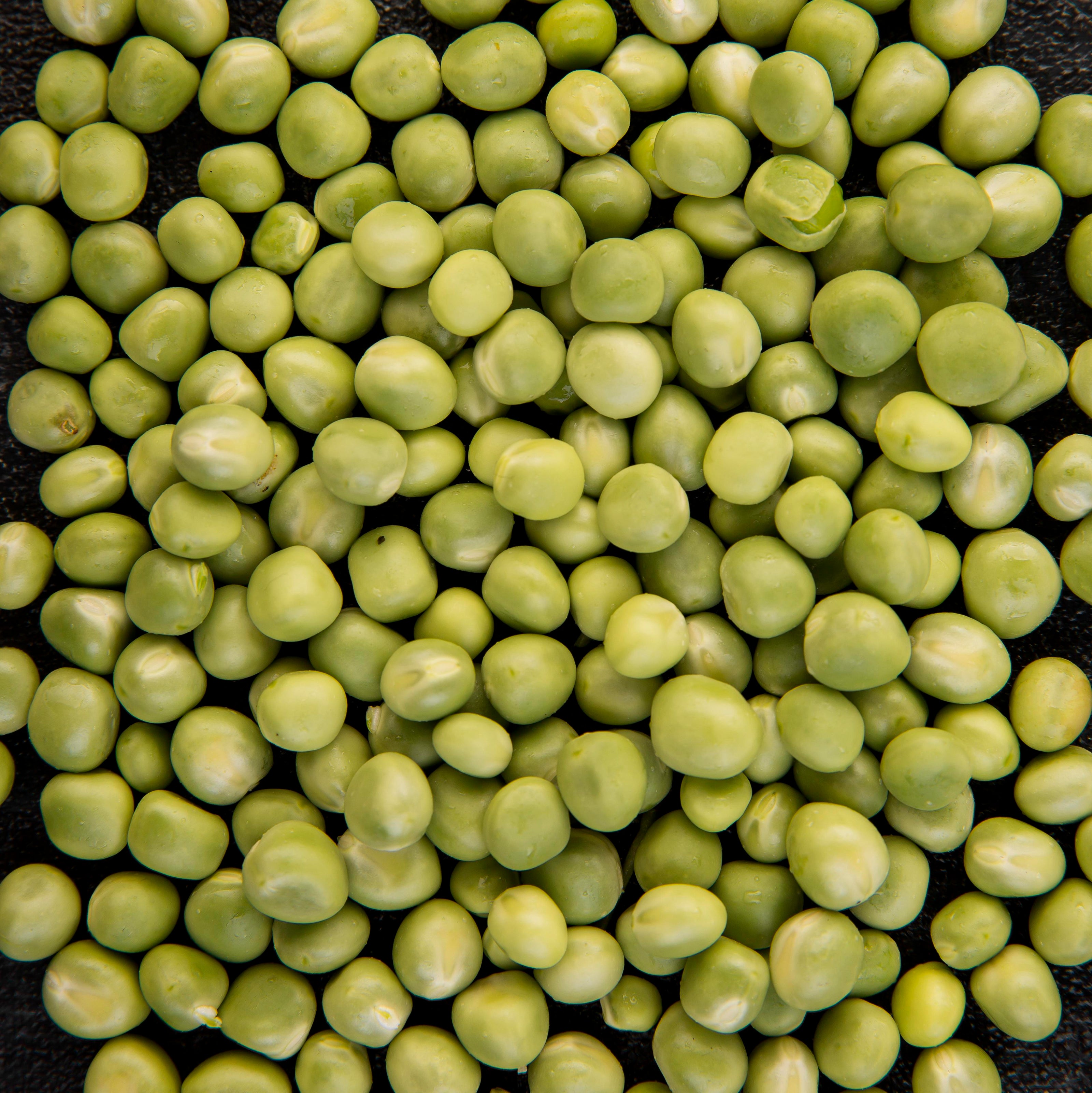 Close-up of green peas on a black background
